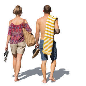 two people walking barefoot at the resort going swimming