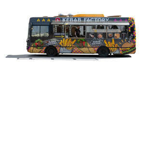 backlit food truck with workers making food inside