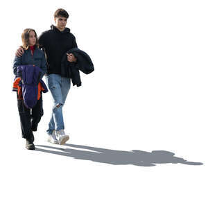 backlit couple walking together