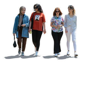 backlit group of four girls walking