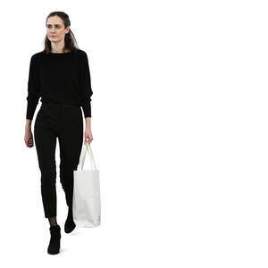 woman in black clothing walking casually