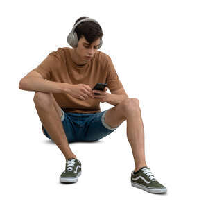 man sitting and listening to music
