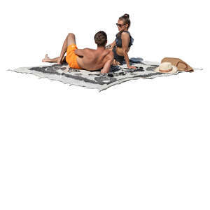couple sunbathing and talking on the beach