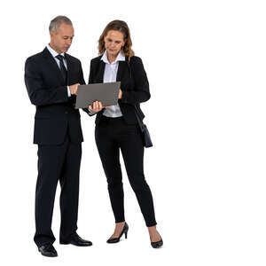 two office workers standing and looking at laptop