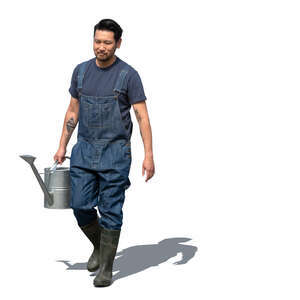 asian gardener walking and carrying a watering can