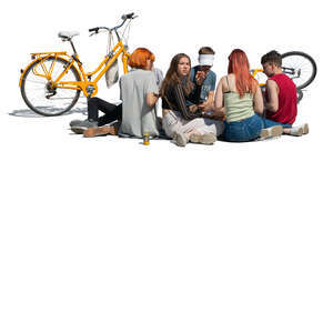 group of teenagers sitting on the ground