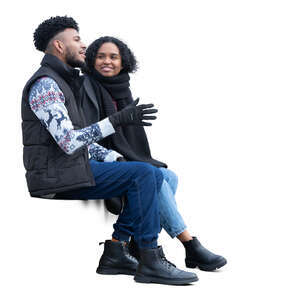 man and woman sitting and talking