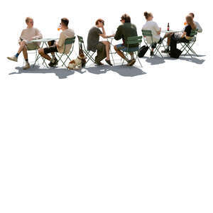 backlit outdoor cafe scene with people sitting and talking