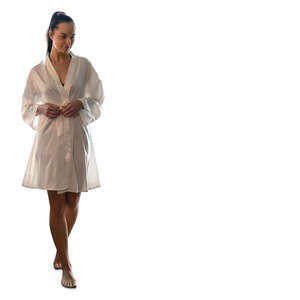 woman in a silky bathrobe walking barefoot