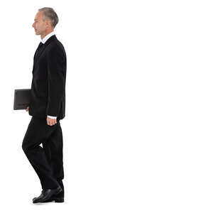 side view of a man in a suit walking