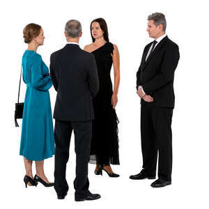 group of four people standing and talking