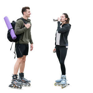 man and woman with rollerblades standing and resting