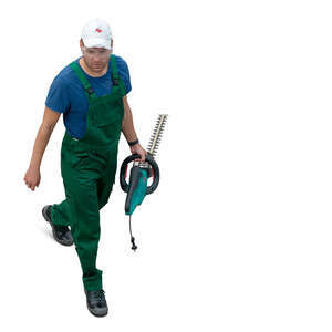 man with a hedge cutter walking seen from above