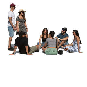 group of friends sitting in a park and relaxing