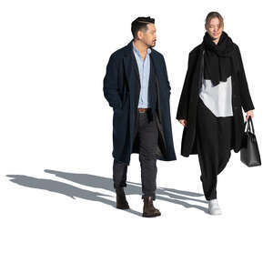 man and woman walking outside