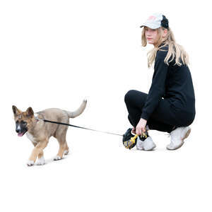 girl with a puppy squatting