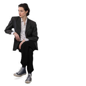 woman sitting and leaning her elbow on a table