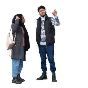 man and woman standing and pointing at smth