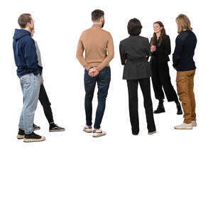 group of people listening to a guide talking