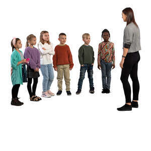 group of children standing and listening to a teacher