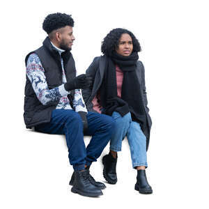 man and woman in autumn sitting and talking