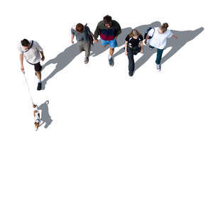 group of people and a dog walking seen from above
