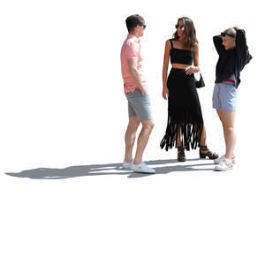 sidelit group of three people standing