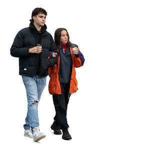 young couple in autumg walking and drinking coffee
