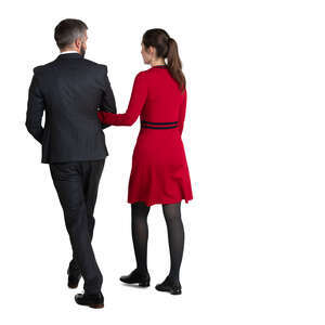 couple in suit and dress walking arm in arm