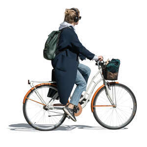 woman with headphones riding a city bike