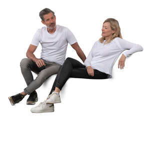middle aged man and woman sitting on a sofa