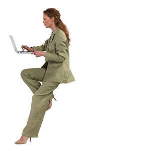 woman sitting and working with laptop