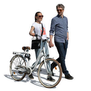 couple with bicycle walking