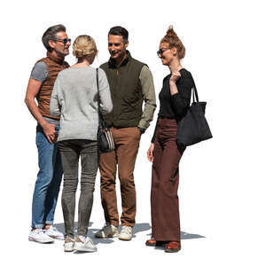 group of four people standing outside and talking
