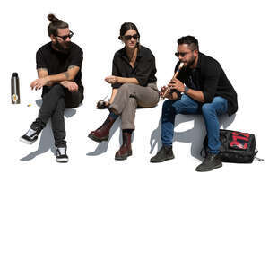 group of latin american friends sitting and making music