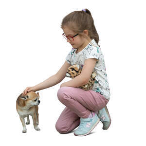 little girl petting a small dog