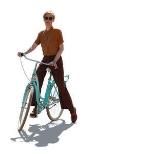 backlit photo of a woman with a bike