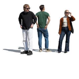 three people standing on the street