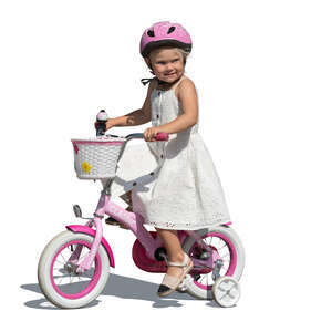 little girl in a white dress riding a bike