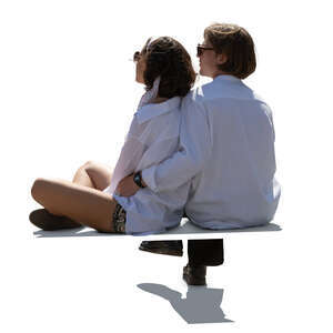 backlit young couple sitting