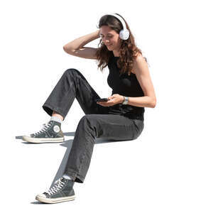 woman sitting and listening to music