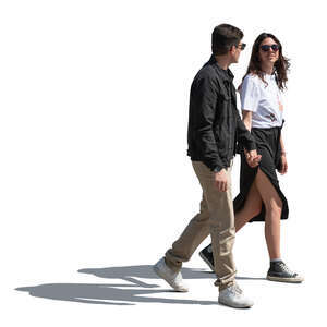 sidelit man and woman walking and holding hands