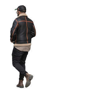 black man with a baseball cap walking