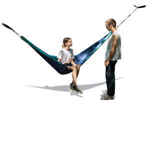 woman sitting in a hammock under a tree and talking to a guy