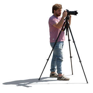 backlit man with a photo camera standing