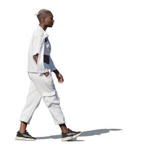 black woman in white outfit walking
