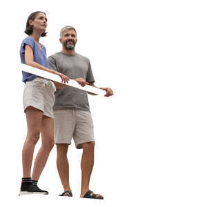 man and woman standing up on a balcony
