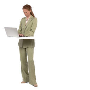 woman standing by a desk and working with a computer