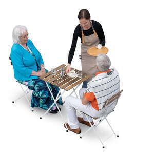 two older people sitting in a cafe and waitress bringing them coffee
