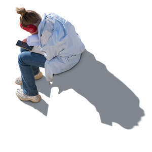 backlit woman sitting seen from above
